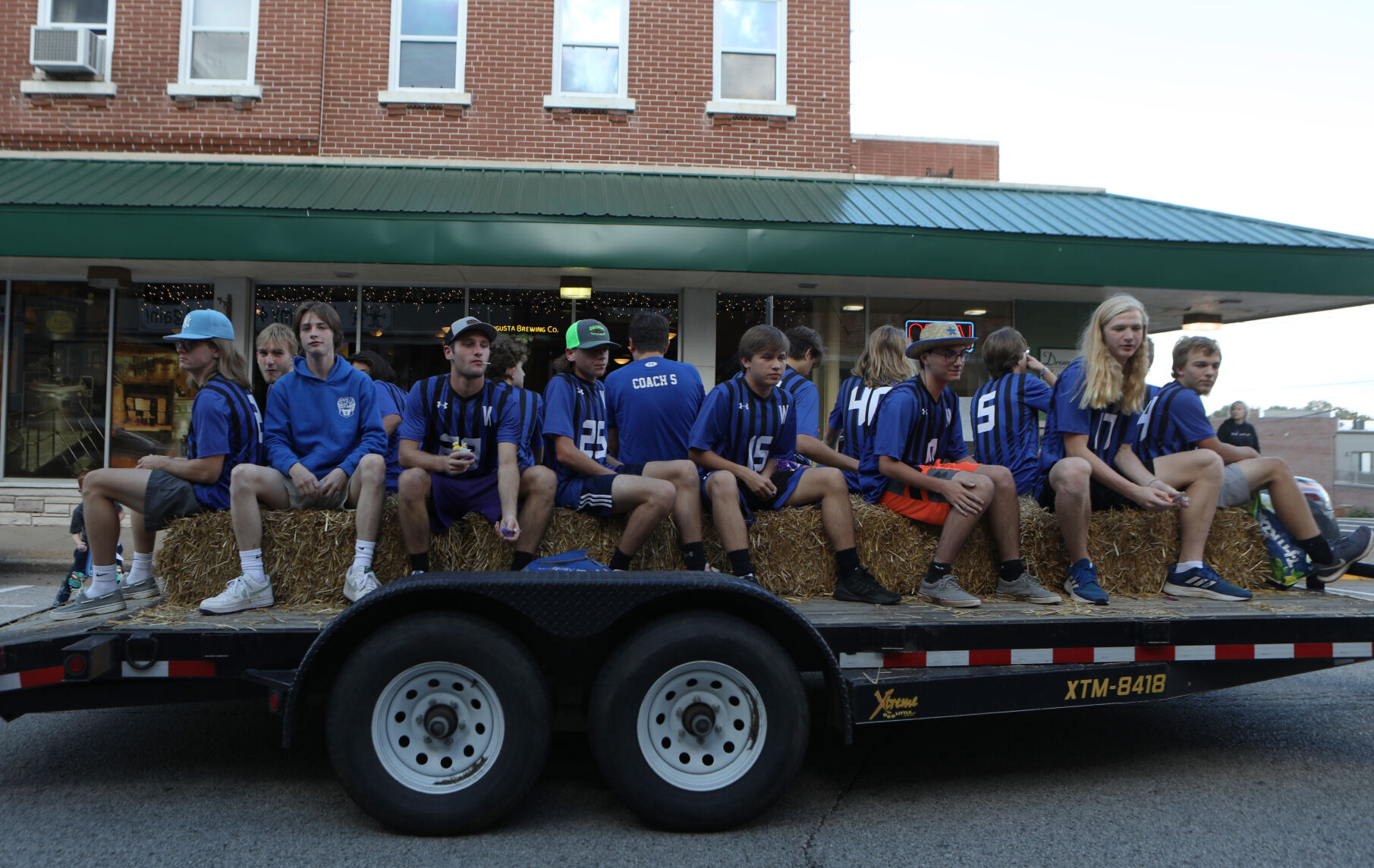 Boy's soccer players ride in homecoming parade